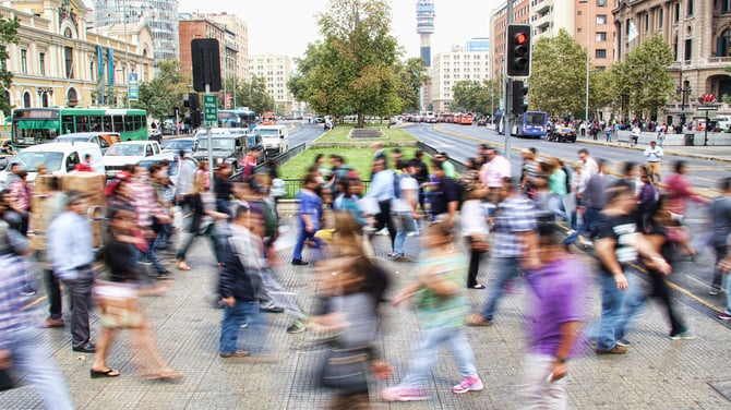 people crossing busy street