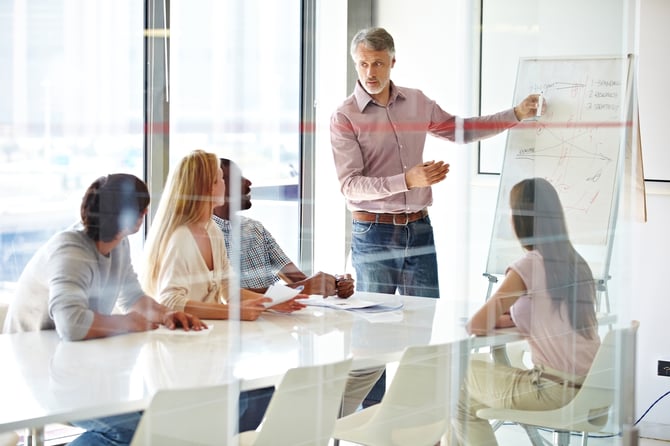 employee leading meeting in modern office